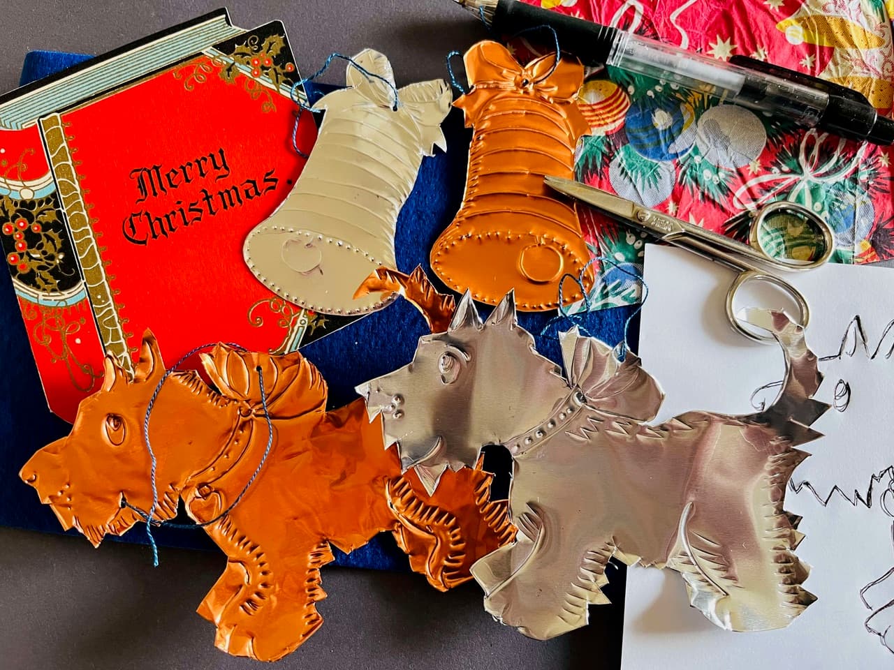 Assorted embossed Christmas decorations in the shape of dogs and bells