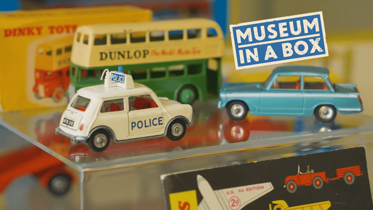 Old match box toy cars from the 1980s and a model bus