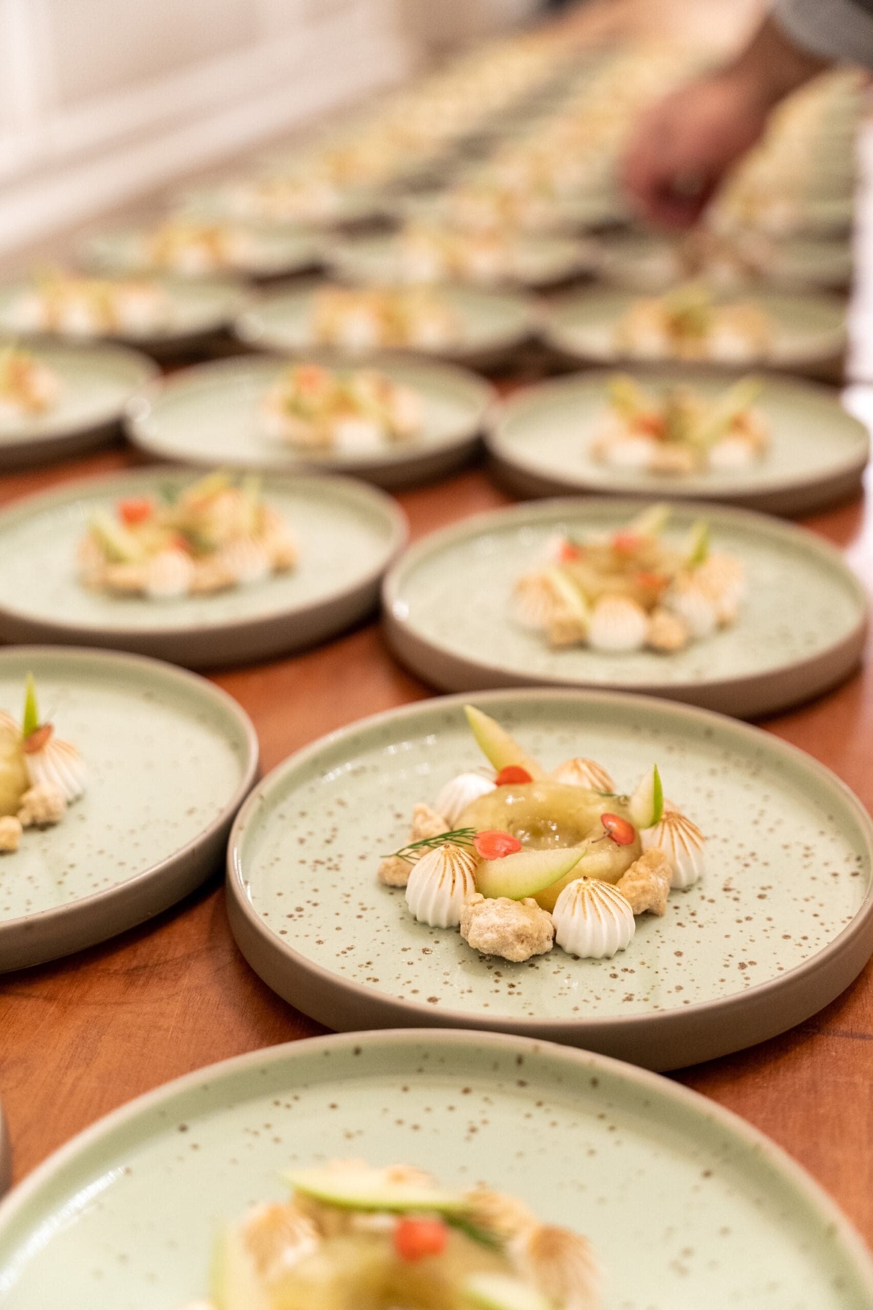 A table filled with various plates of food, showcasing a colorful assortment of dishes ready for serving.
