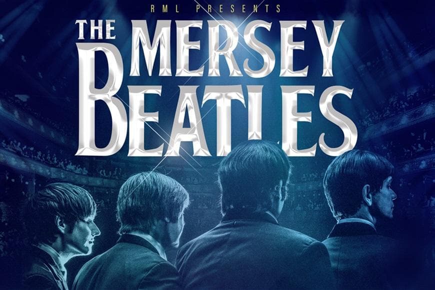 Image of The Beatles looking out to crowd