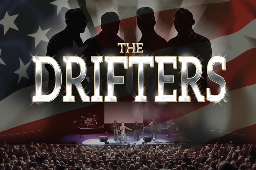 Silhouette of 4 men above a stage and audience below.