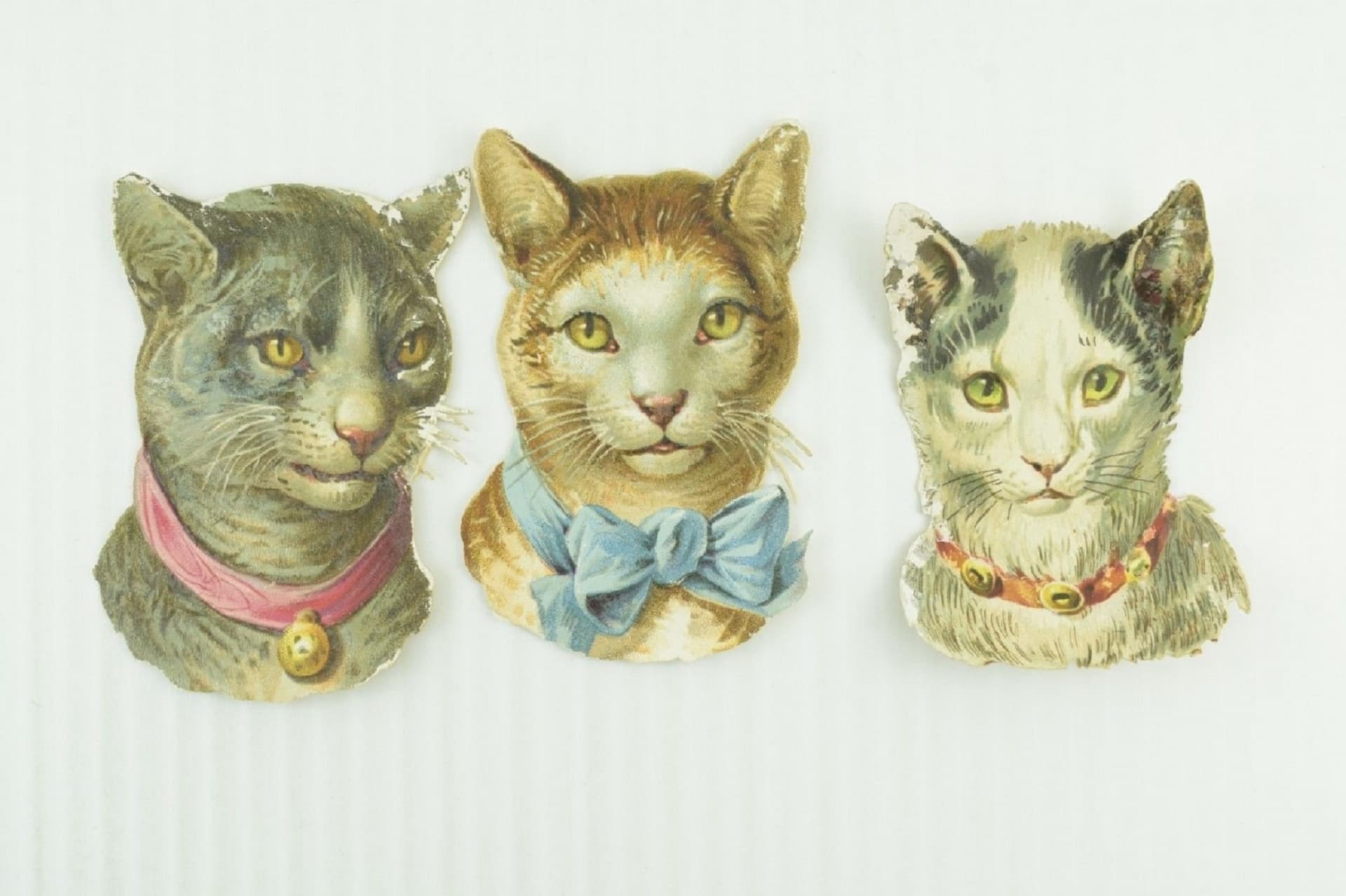 Victorian scraps of cat heads