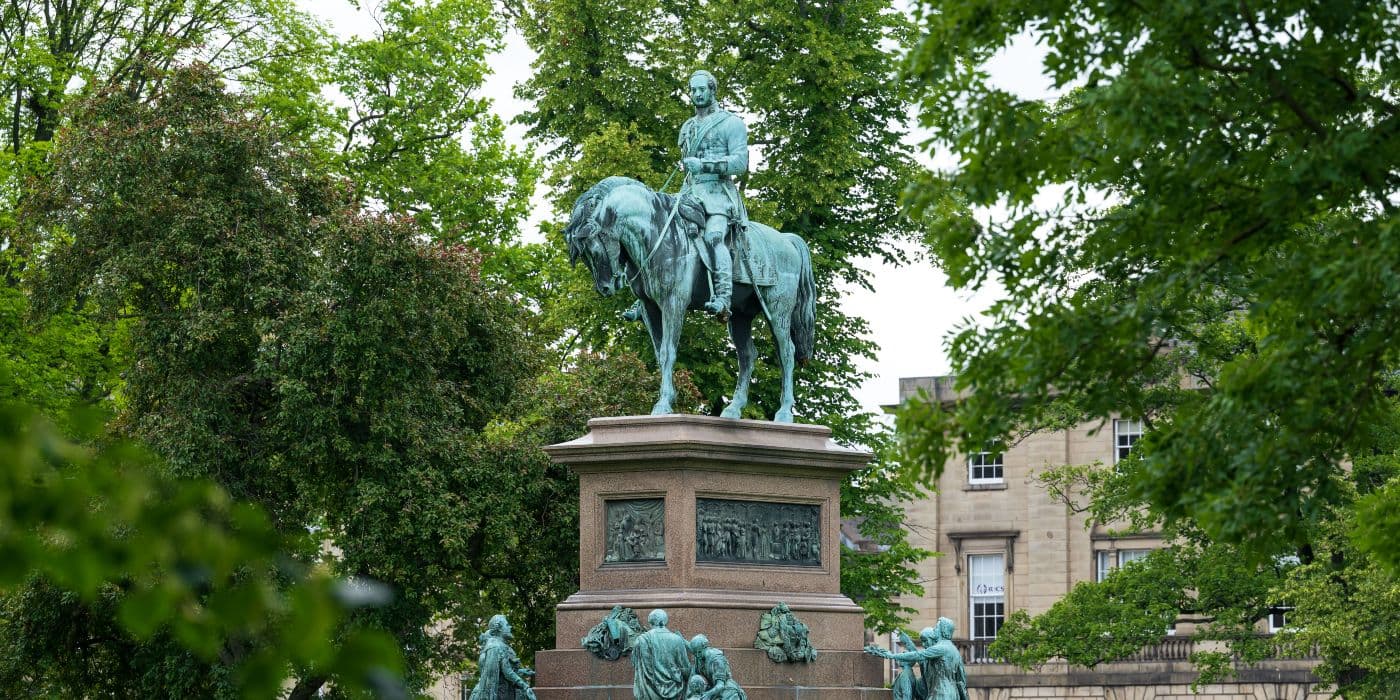 Statue of Prince Albert surrounded by trees