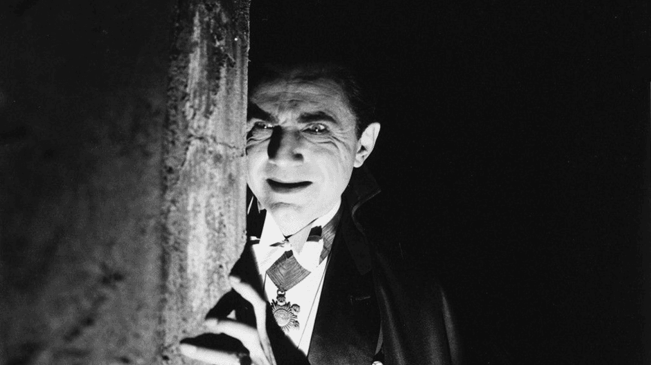 Black and White Image of man dressed as Dracula 
