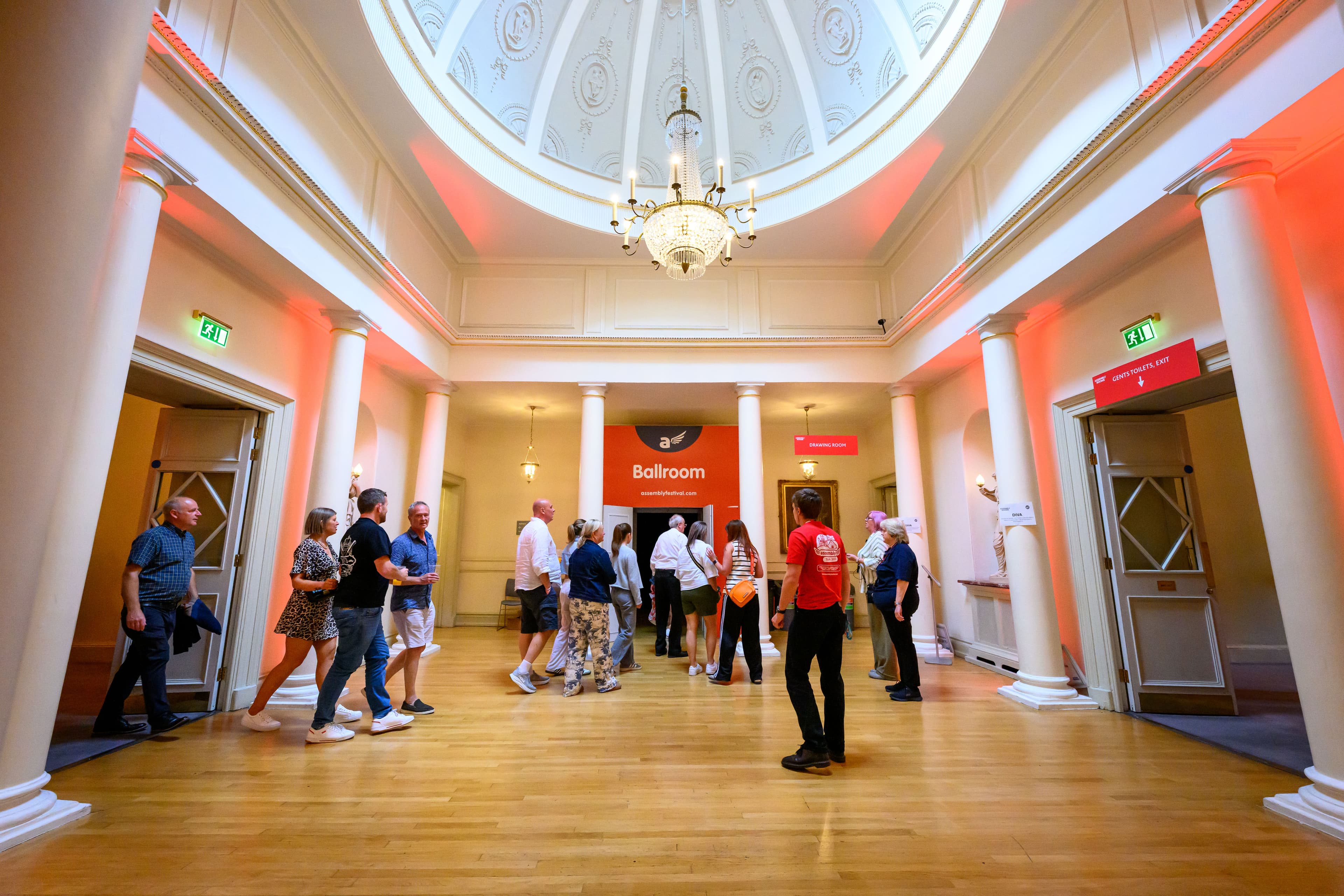 Assembly rooms crush hall during the fringe while chandelier lit up