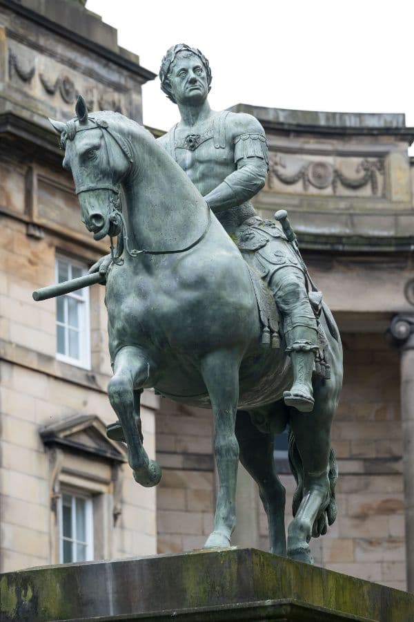 Closeup of a statue of a warrior riding a horse