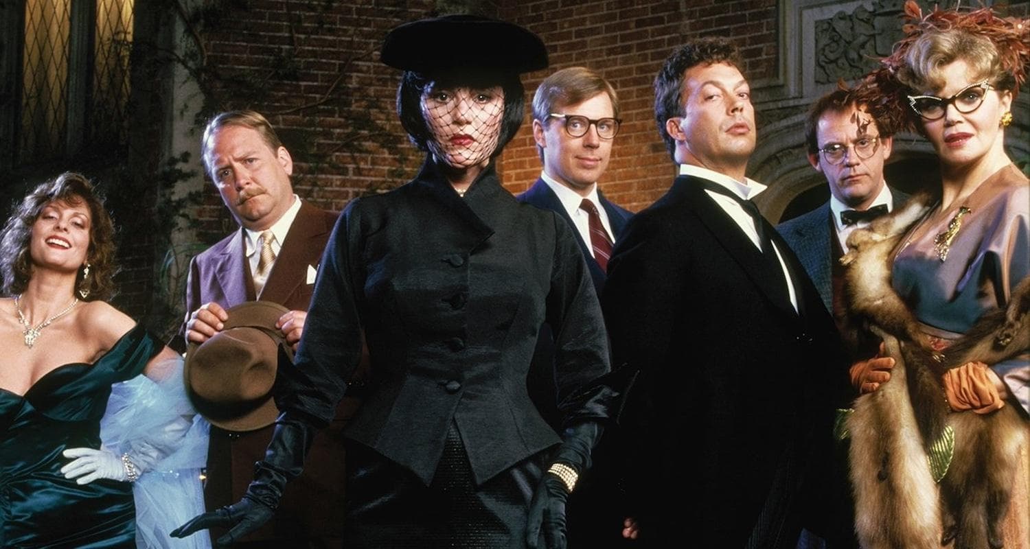 Seven cast members from the hit film Clue (1985). Madeline Kahn as Mrs White is featured in the centre looking at the camera. 