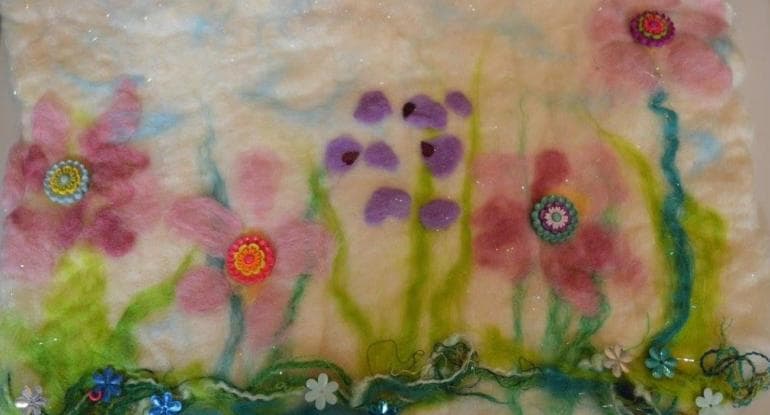 felt panel featuring two pink and one purple flower