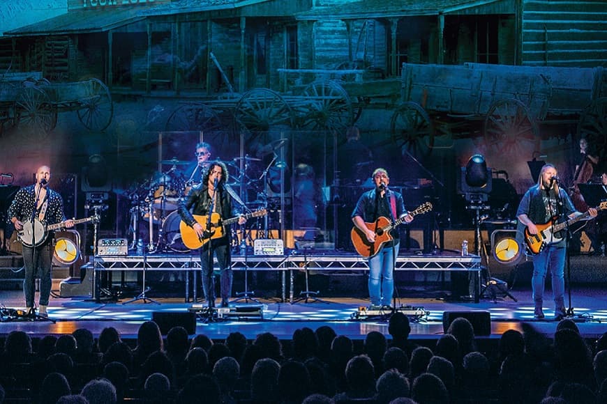 The Illegal Eagles on stage performing to an audience