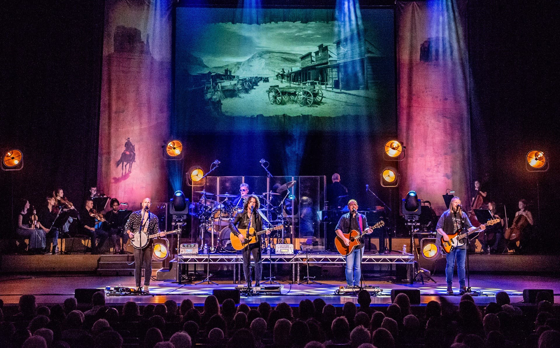 Eagles tribute band on stage performing to a crowd 