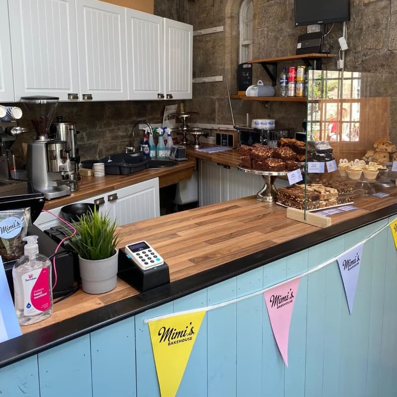 The counter at Mimi's Little Bakehouse at Lauriston Castle in Edinburgh displaying an assortment of cakes.