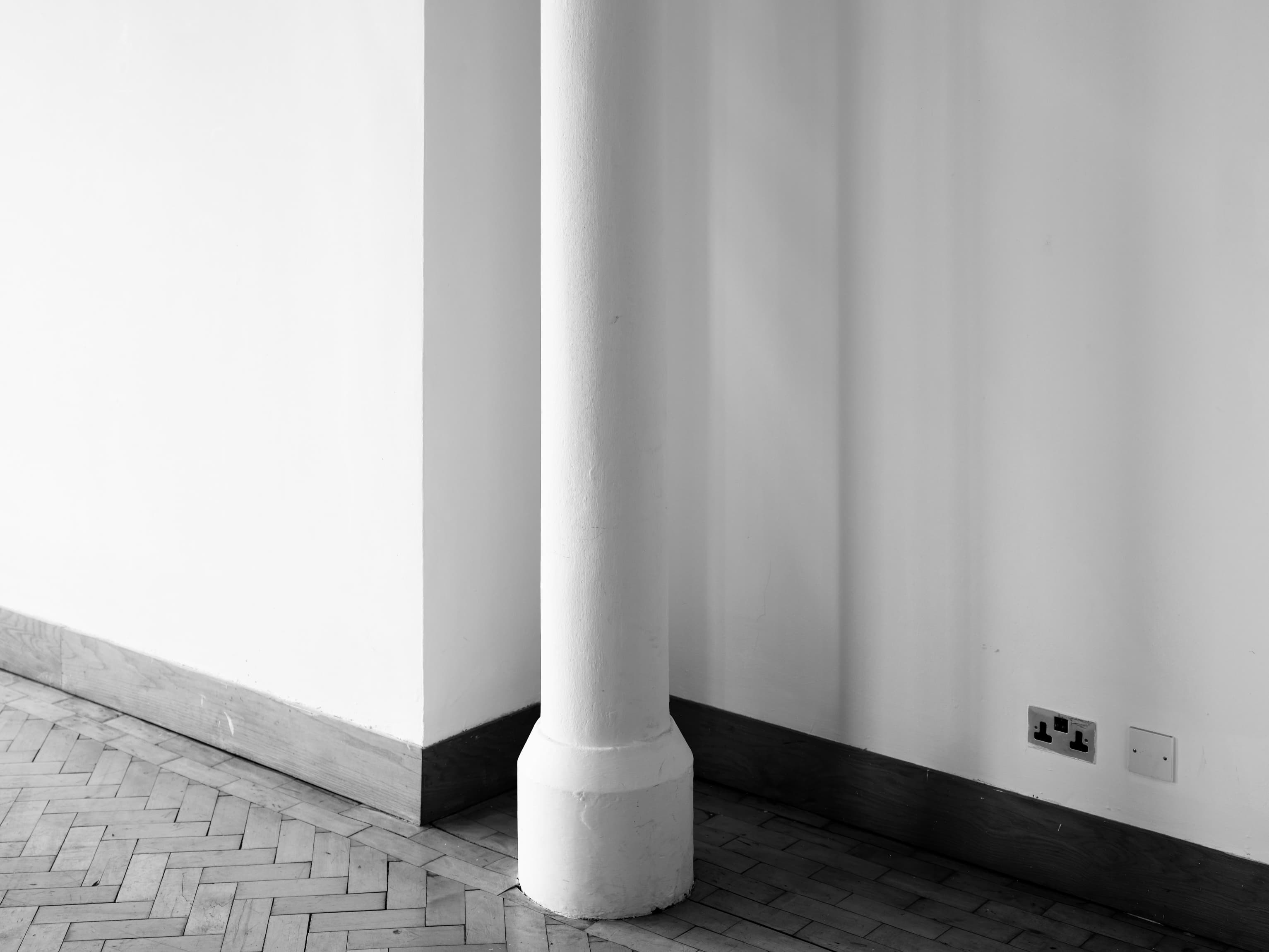 Black and white photo of a white pillar in Edinburgh's City Art Centre