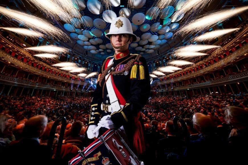 Drummer with audience in backdrop