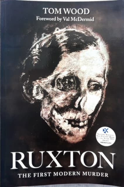 Book cover of "Ruxton, The First Modern Murder" by Tom Wood, featuring an eerie face / skull.