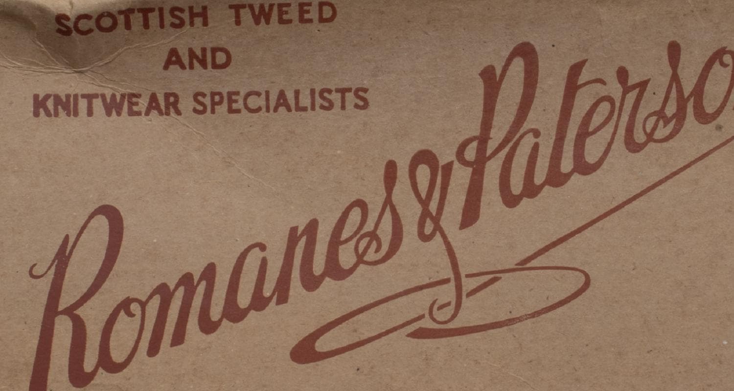 Vintage delivery box from the old Edinburgh department store Romanes & Paterson. The name of the company is featured on the box together with the words "Scottish tweed and knitwear specialists"