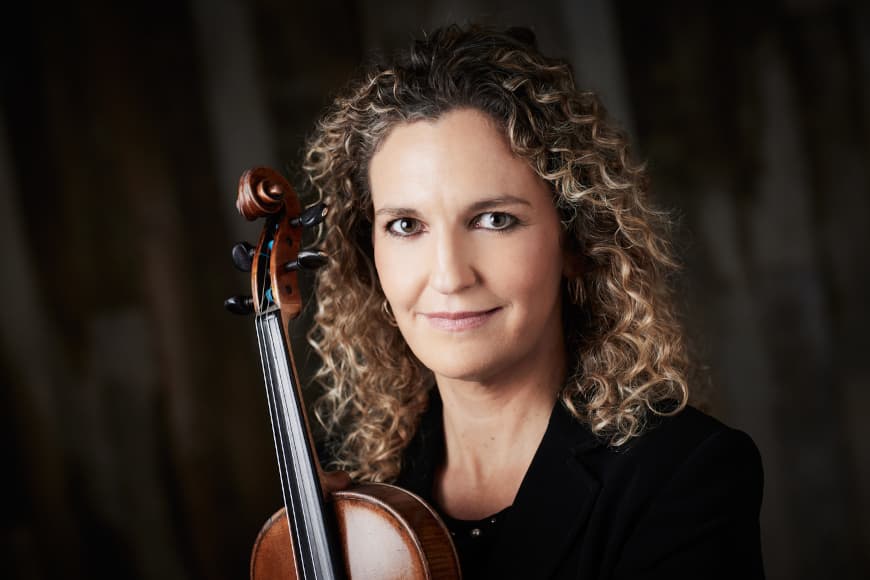 Photograph of Ruth Rogers holding her violin