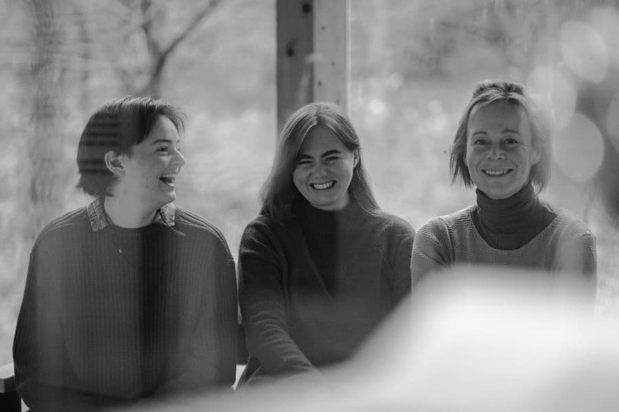 Image shows members of Tripple smiling