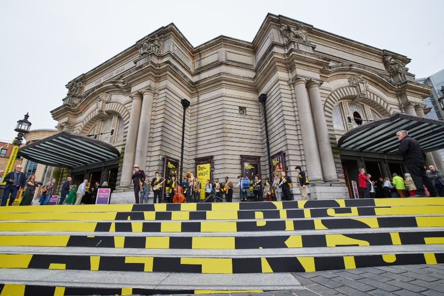 Exterior of usher hall showing yellow EIF branding on the steps