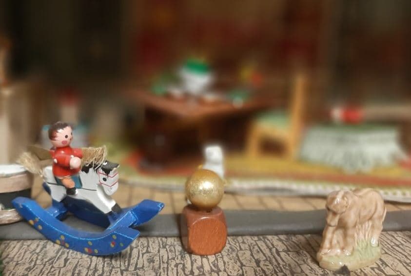 Wooden childs toy  - small boy on a rocking horse