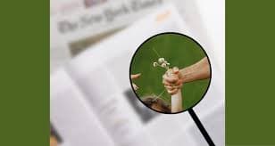 Magnifying Glass showing two clasped hands 