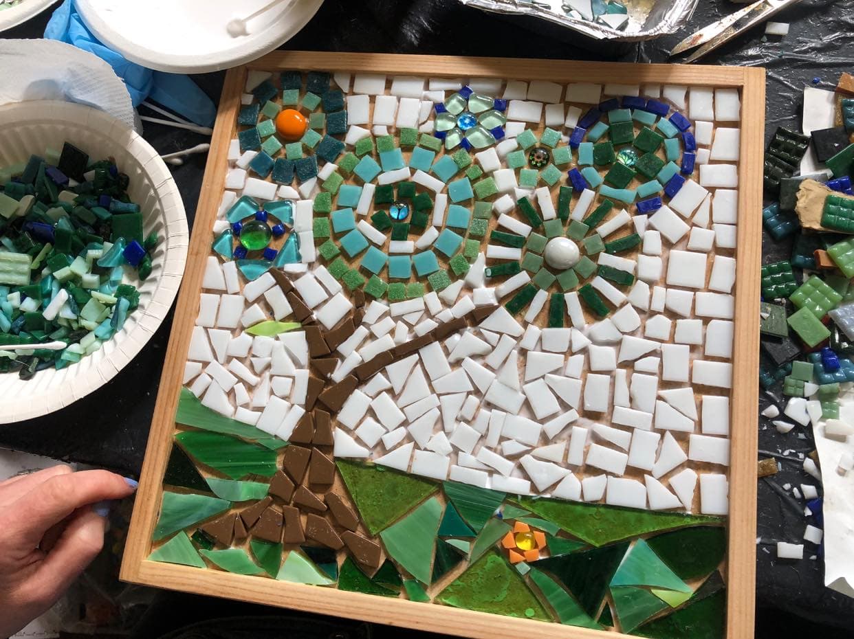 Mosaic of a tree in a square wooden frame