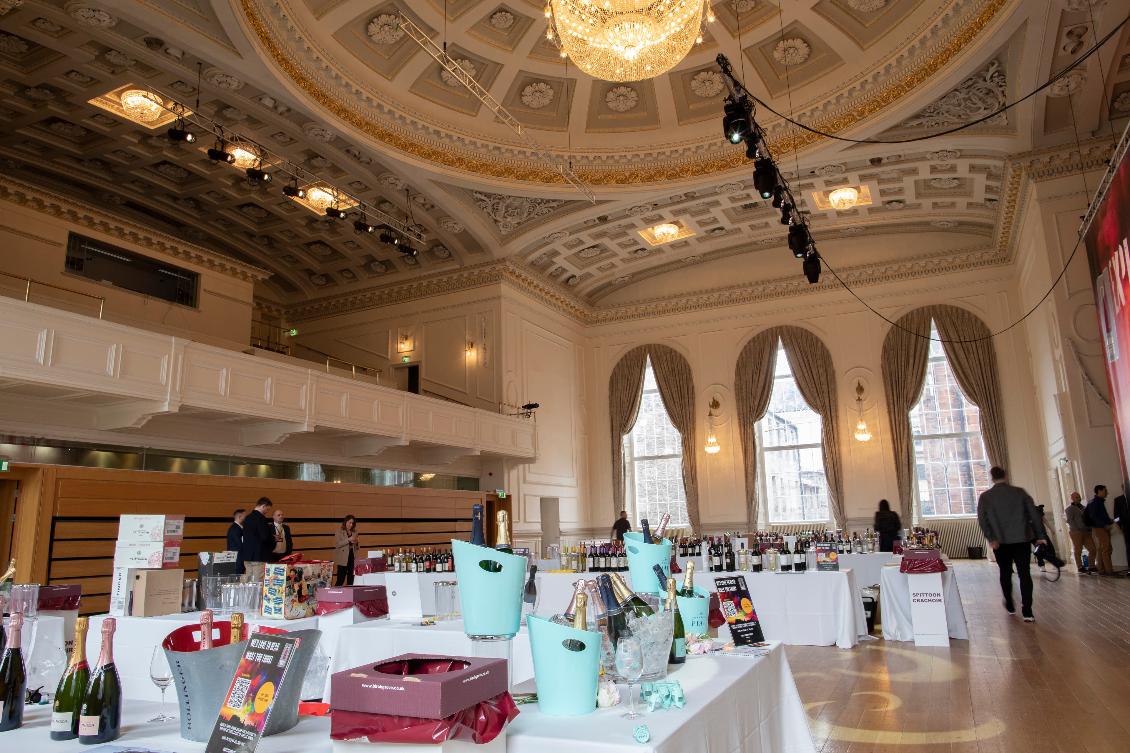 Music Hall with tables covered in boxes of wine.