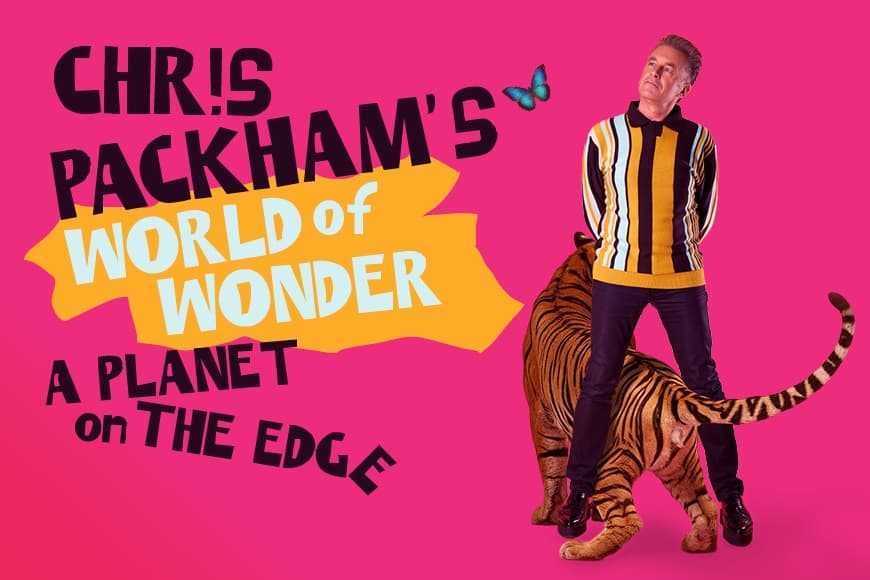 Image of Chris Packham standing with tiger