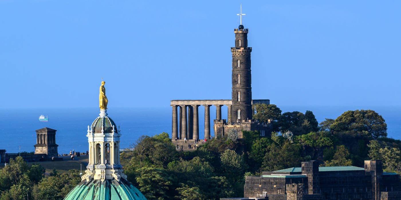Image of the telescope-shaped Nelson monument on top of a hill