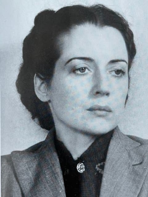 Black and white head and shoulders photo of a woman