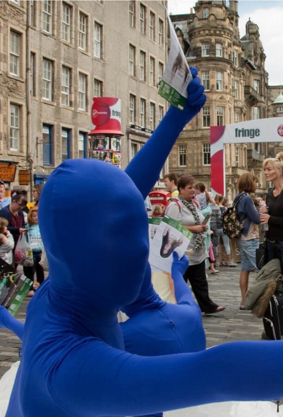 Performers handing out leaflets at Edinburgh Fringe Festival, Royal Mile