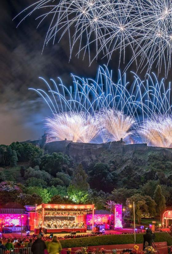 Festival concert at the Ross Bandstand in Princes Street Gardens with fireworks above Edinburgh Castle