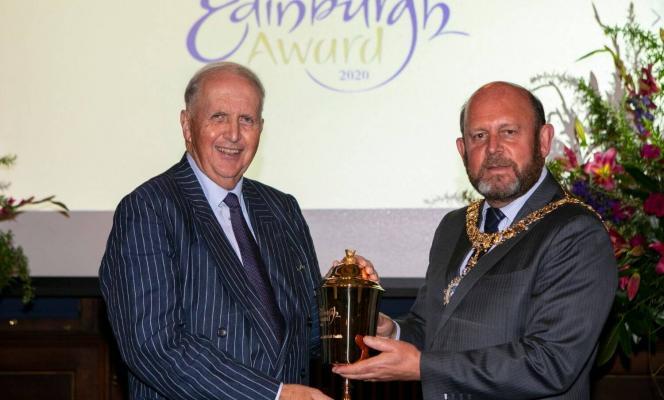 Alexander McCall Smith holding the Edinburgh Award Loving Cup with Lord Provost Frank Ross